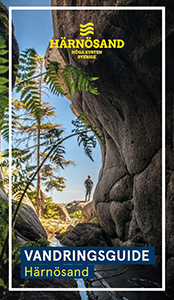 person utanför grotta